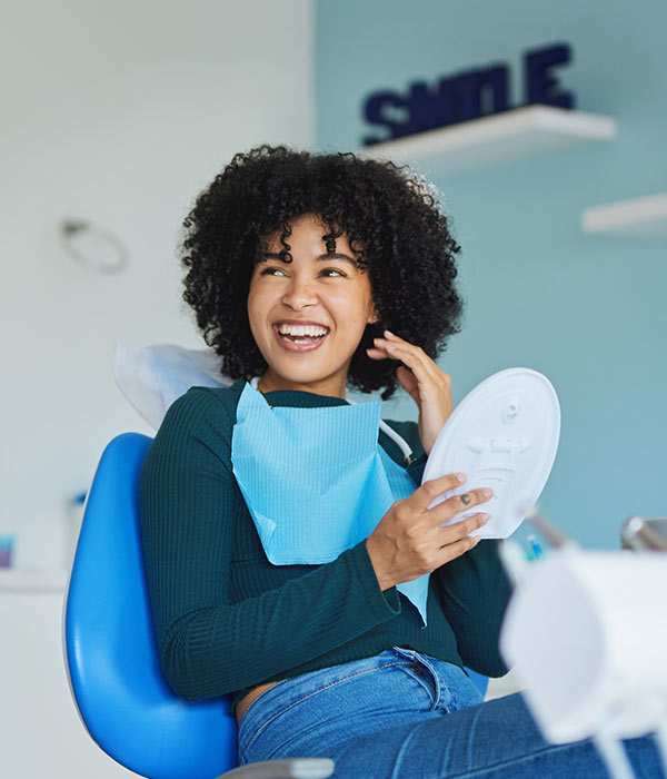 woman smiling at dentist office